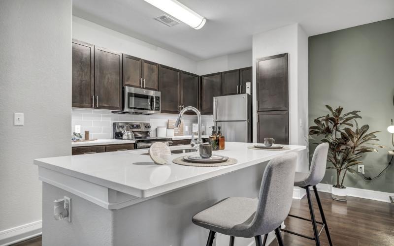 a kitchen with a white countertop