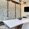 a dining room table with a tv on the wall