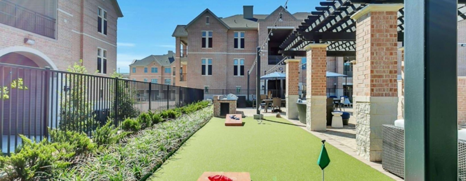 a backyard with a table and chairs